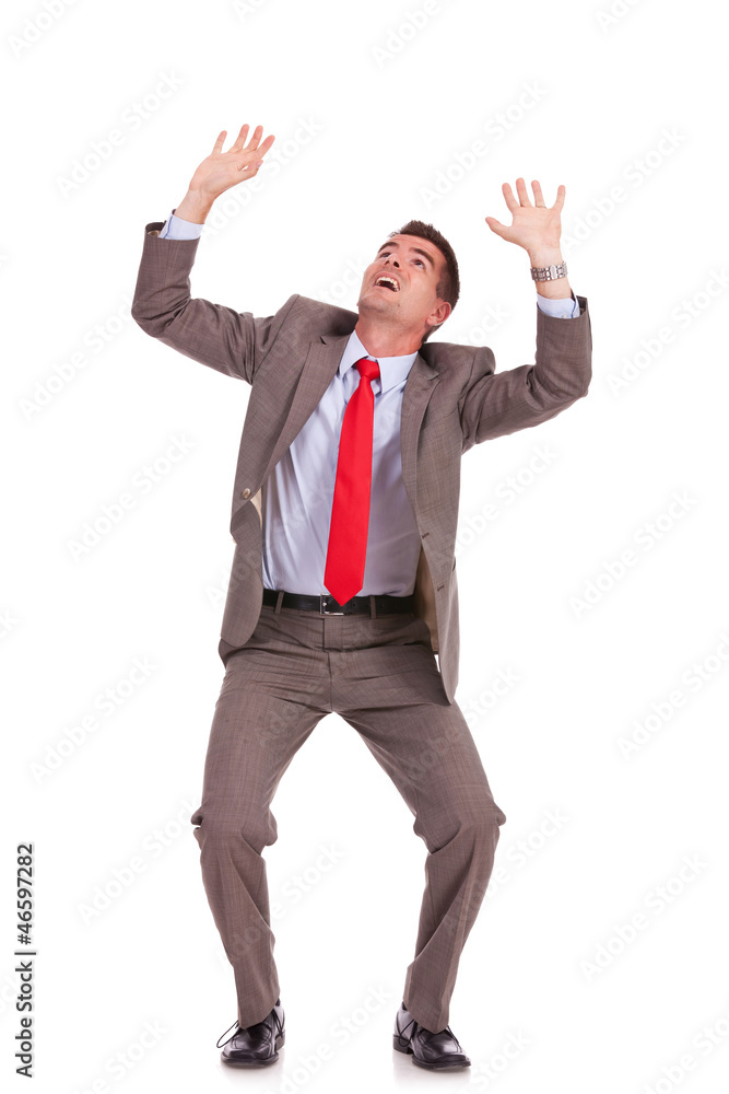 business man holds something above head business man holds something above head
