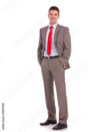 young business man with hands in pockets