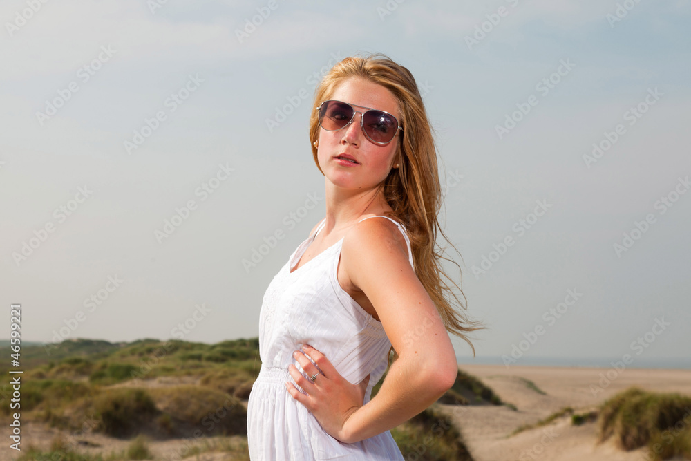 Pretty girl red long hair wearing white dress enjoying nature. Pretty girl red long hair wearing white dress enjoying nature.