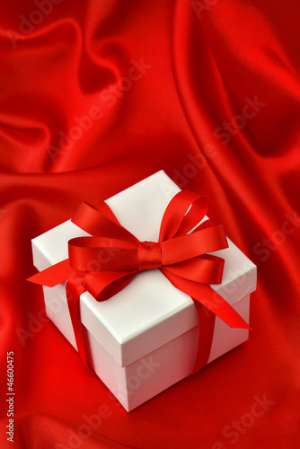 Wallpaper Mural white gift box with red ribbon over silk Torontodigital.ca