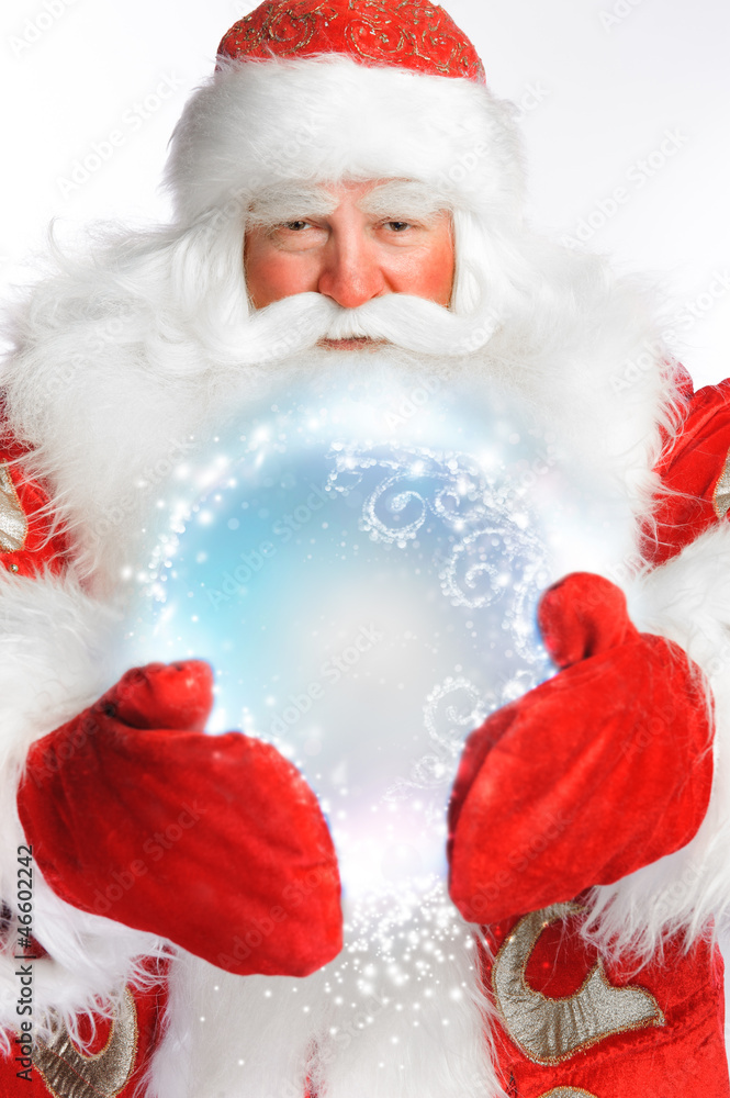 Traditional Santa Claus holding magic snowball Isolated on white Traditional Santa Claus holding magic snowball Isolated on white