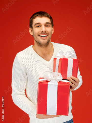 man holding many gift boxes