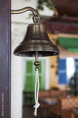 Antique brass ship's bell with a rope