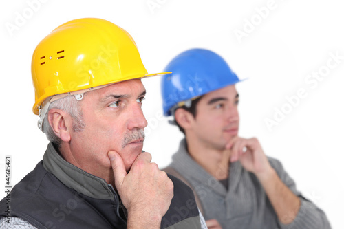 Thoughtful construction workers
