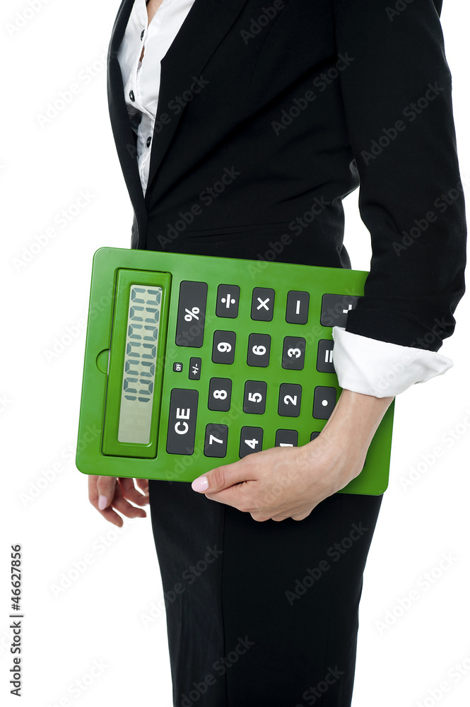 Cropped image of a woman holding big calculator Cropped image of a woman holding big calculator