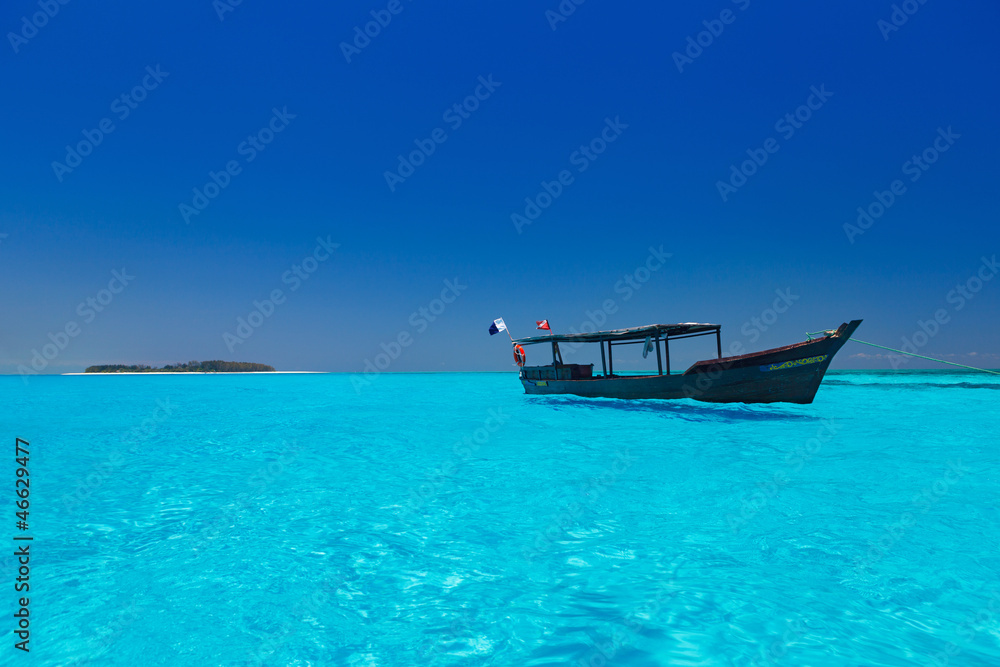 wooden boat in crisp blue water wooden boat in crisp blue water
