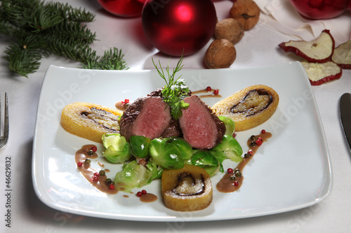 Geschmorter Hasenrücken mit Waldpilzrolade und Rosenkohl photo