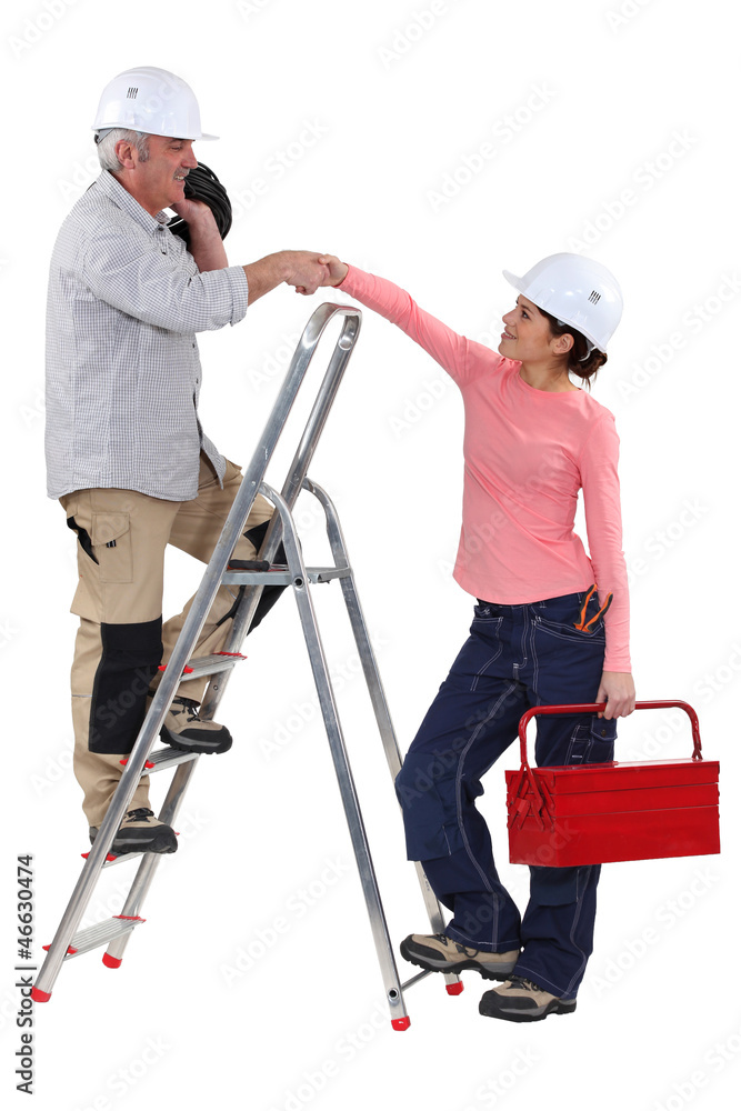 Experienced tradesman meeting his new apprentice Experienced tradesman meeting his new apprentice
