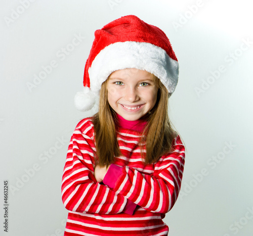 little girl in the santa claus hat