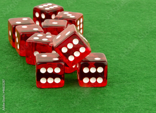 red poker dice on green table