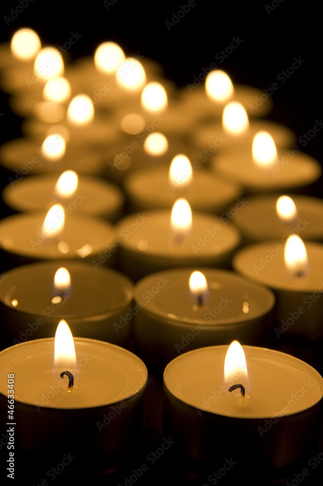 Small candles in dark. Holiday/romance/religion concept Small candles in dark. Holiday/romance/religion concept