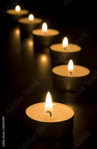 Small candles in dark. Holiday/romance/maditation concept