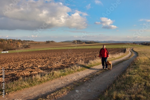 lonely man walking the dog, autumn weather © martinfredy