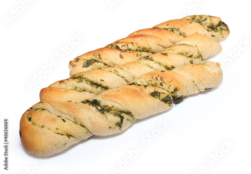 Twisted crisp bread with herbs, isolated on white