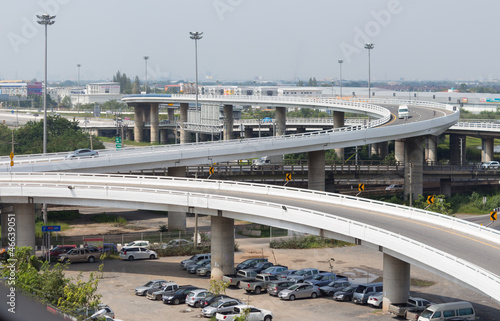 modern concrete elevated roadway and spot-light pole tower