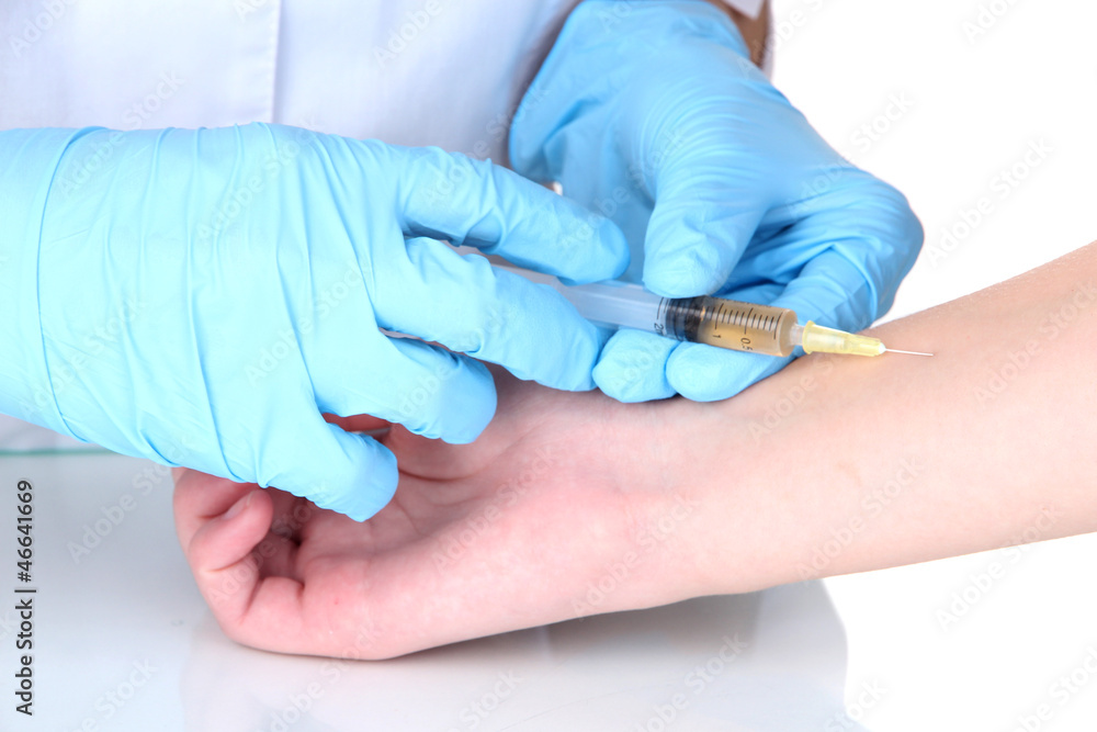 Fototapeta premium vaccine injection in hand isolated on white