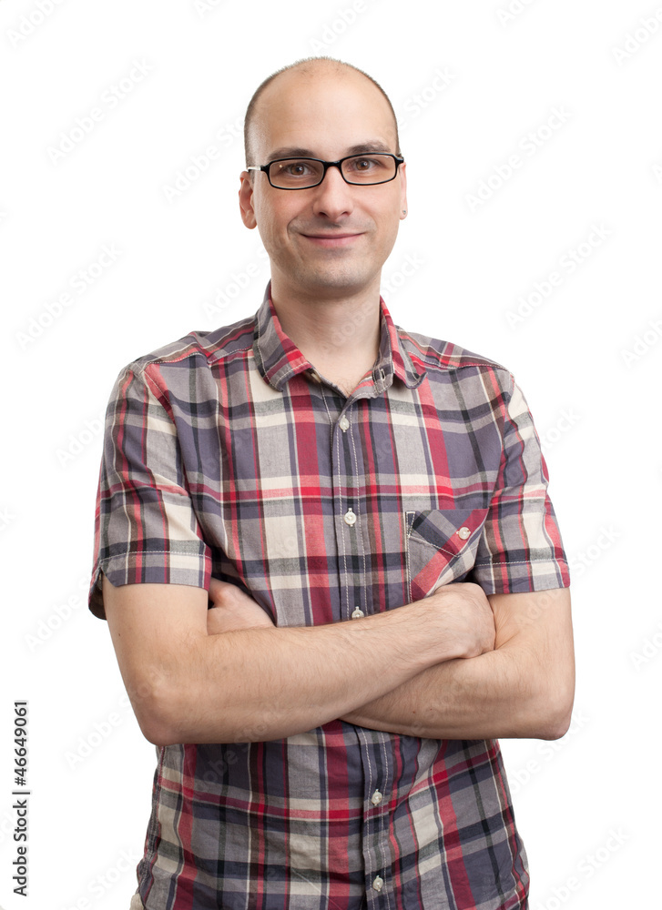 Casual young man looking at camera with arms crossed Casual young man looking at camera with arms crossed