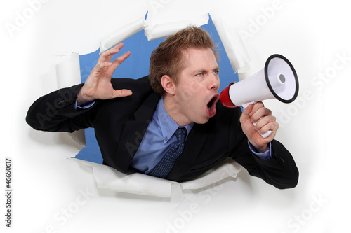 Фотография worker screaming in bullhorn