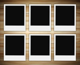 row of polaroid photo on wood background