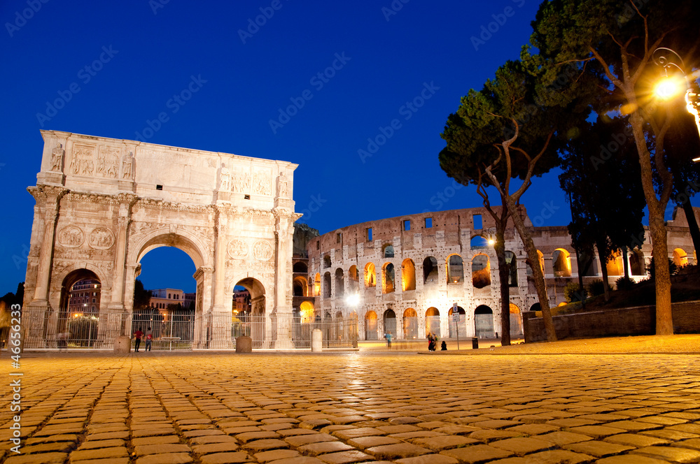 Colosseo and Arco di constantino night view at Roma - Italy