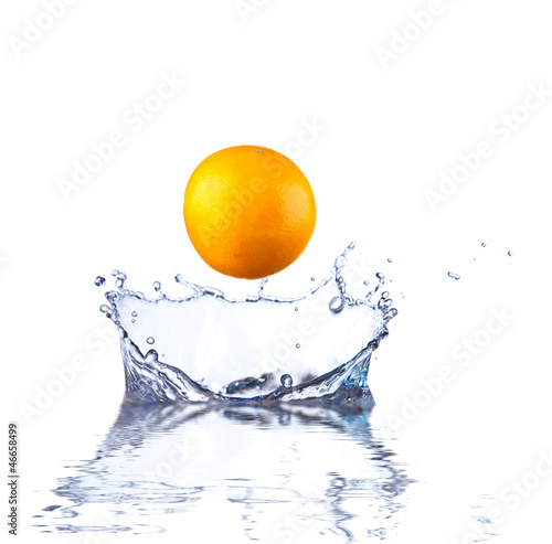 orange splashing into clear water 