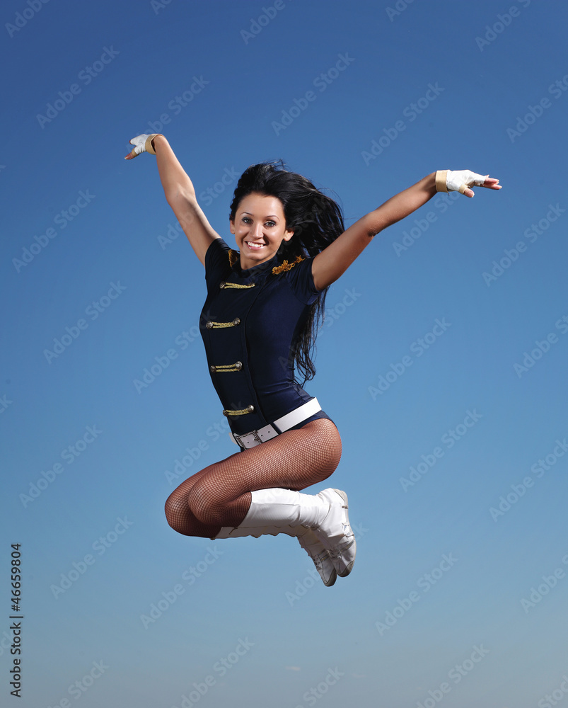 Young female dancer against white background Young female dancer against white background