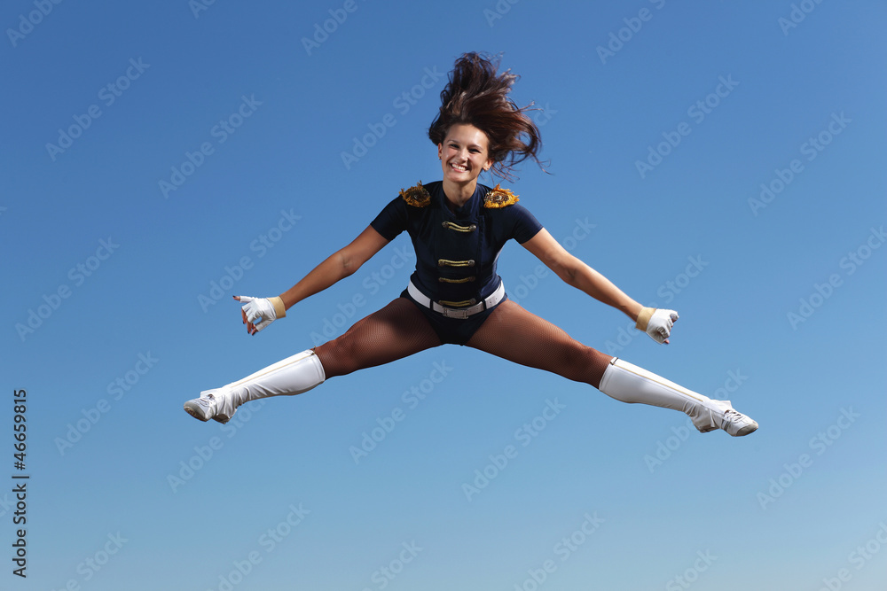 Young female dancer against white background Young female dancer against white background