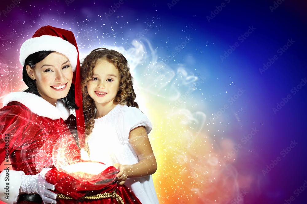 Little girl with christmas gifts and santa Little girl with christmas gifts and santa
