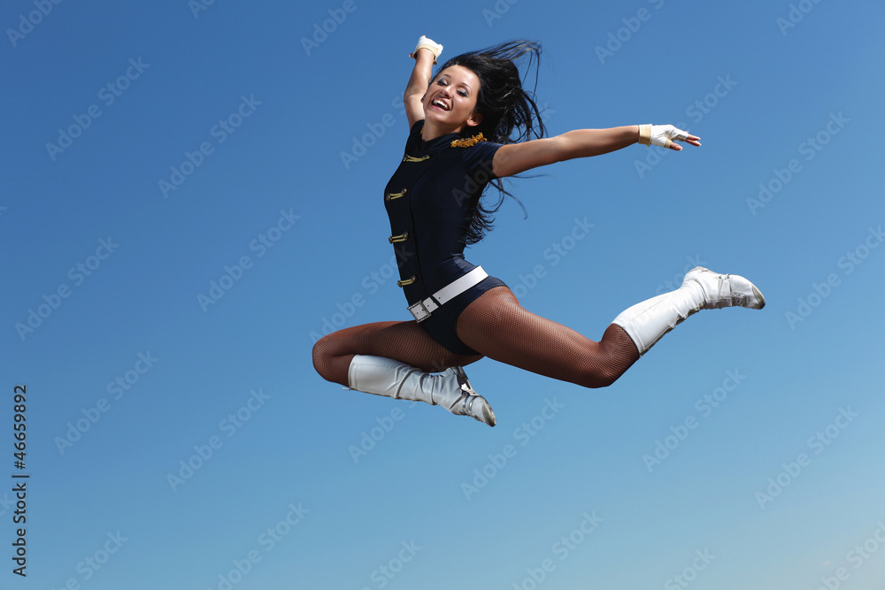 Young female dancer against white background Young female dancer against white background
