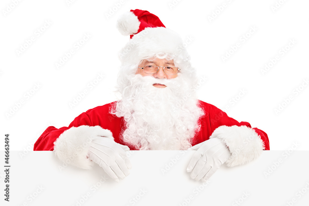 Santa Claus posing behind a blank billboard Santa Claus posing behind a blank billboard