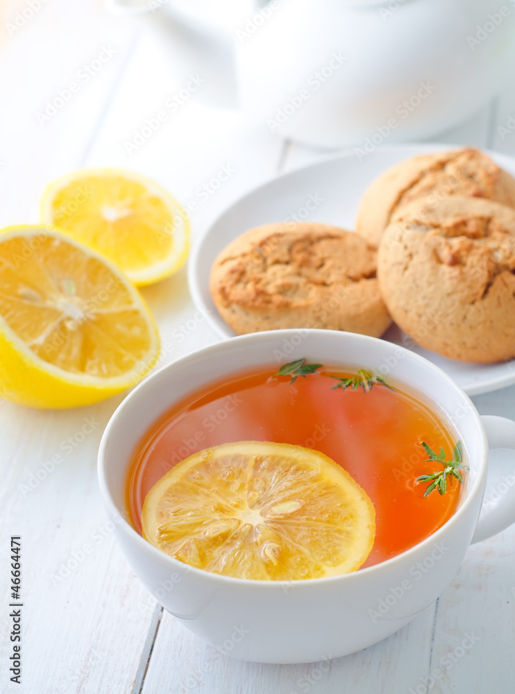Fresh tea with lemon in the white cup Fresh tea with lemon in the white cup