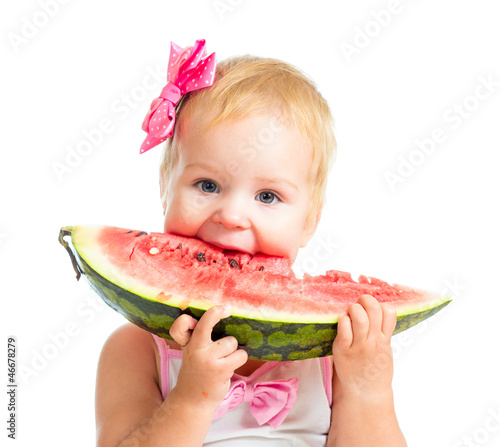 Little girl eating watermel...