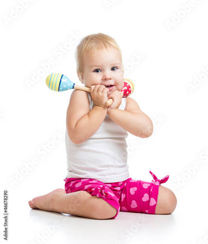 Kid playing with musical to...
