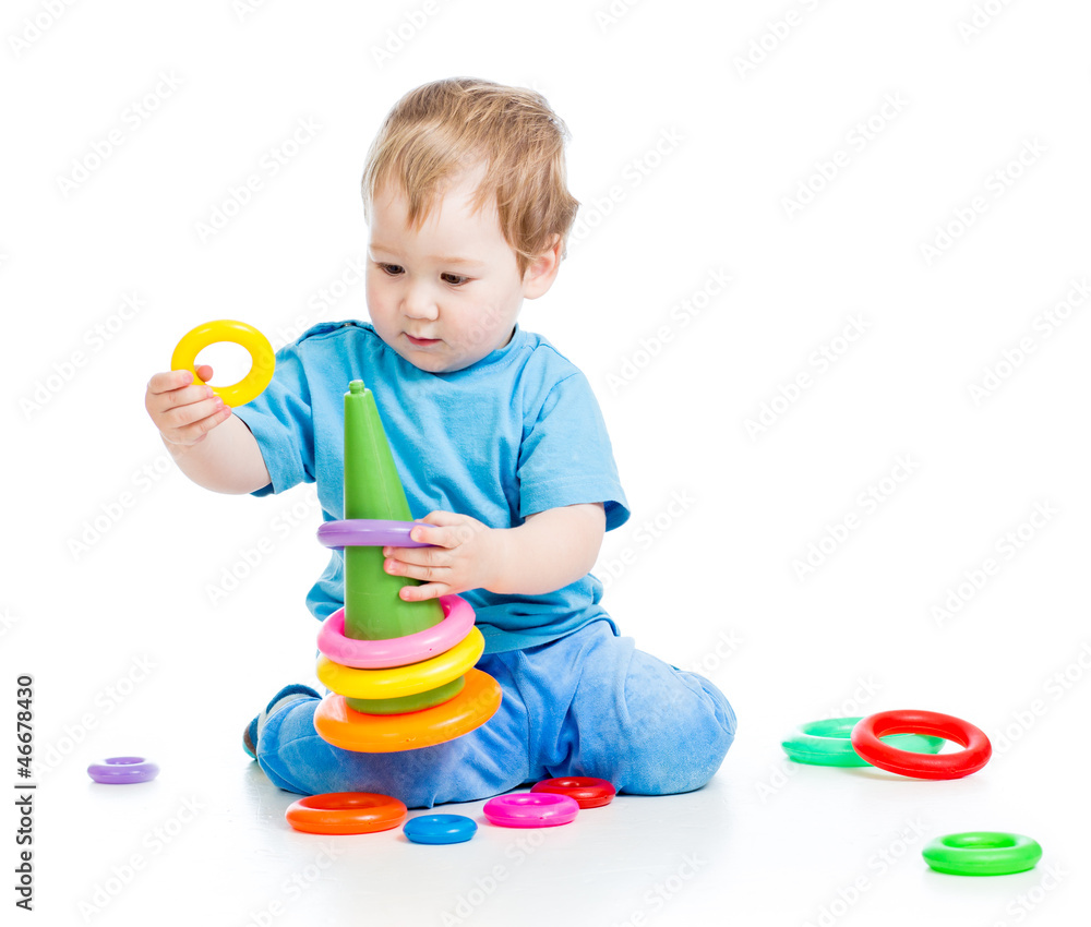 cheerful child playing with colorful toy isolated on white cheerful child playing with colorful toy isolated on white