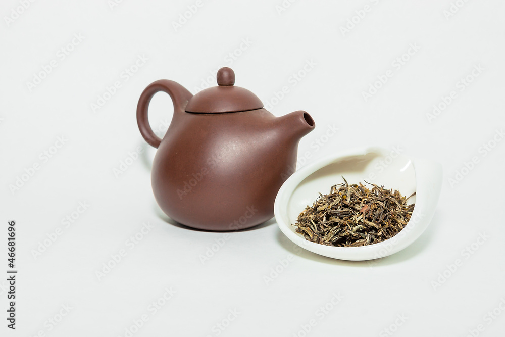 Traditional chinese oolohg tea with a clay teapot on a white bac