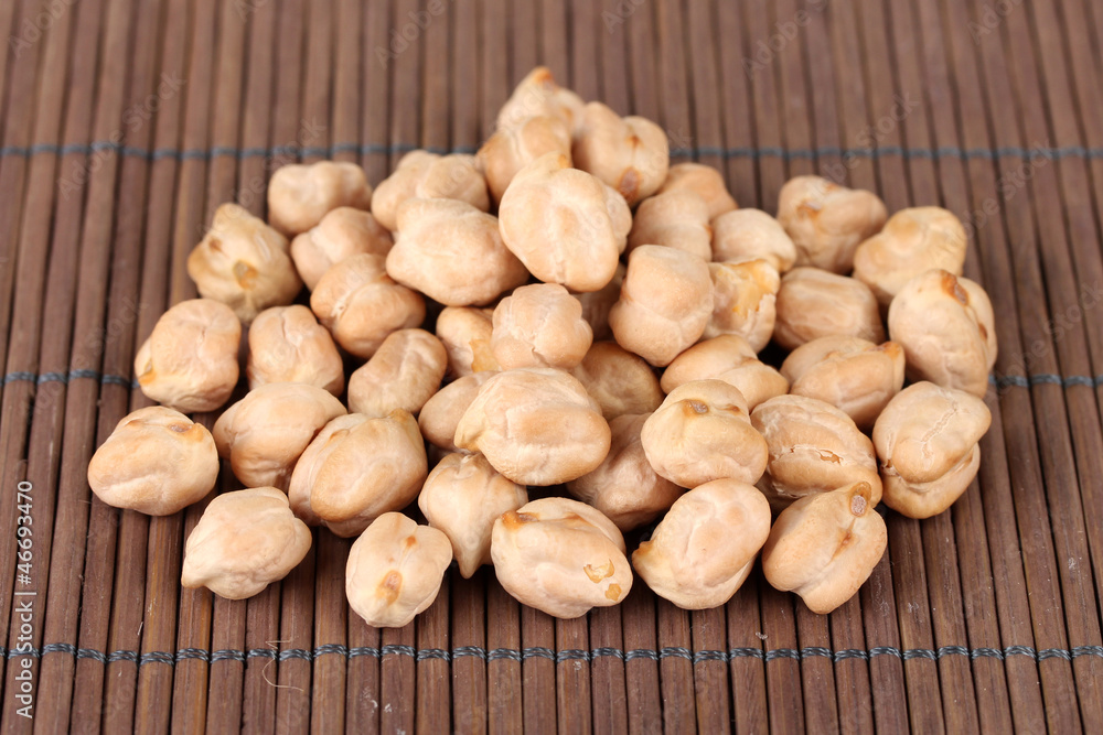 Fototapeta premium White chickpeas on color background