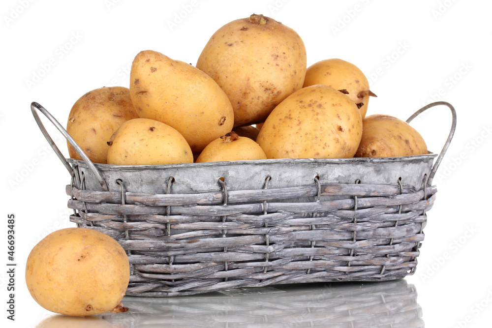 Ripe potatoes on basket isolated on white Ripe potatoes on basket isolated on white