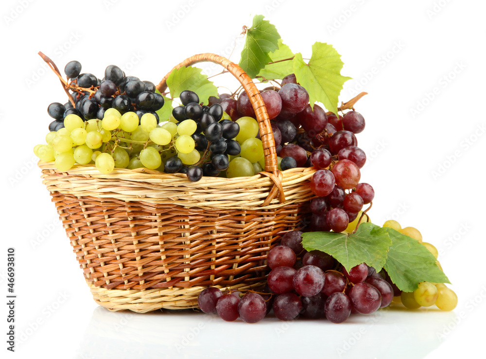 assortment of ripe sweet grapes in basket, isolated on white. assortment of ripe sweet grapes in basket, isolated on white.