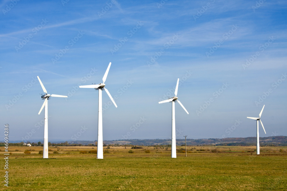 green meadow with Wind turbines generating electricity green meadow with Wind turbines generating electricity