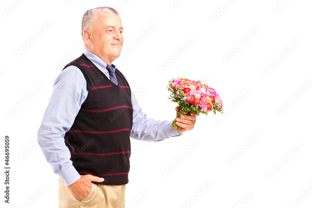 A gentleman holding a bunch of flowers A gentleman holding a bunch of flowers