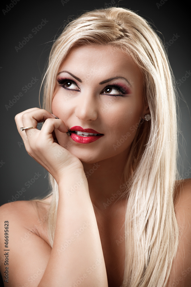 Beautiful topless woman holding hand under her chin Beautiful topless woman holding hand under her chin