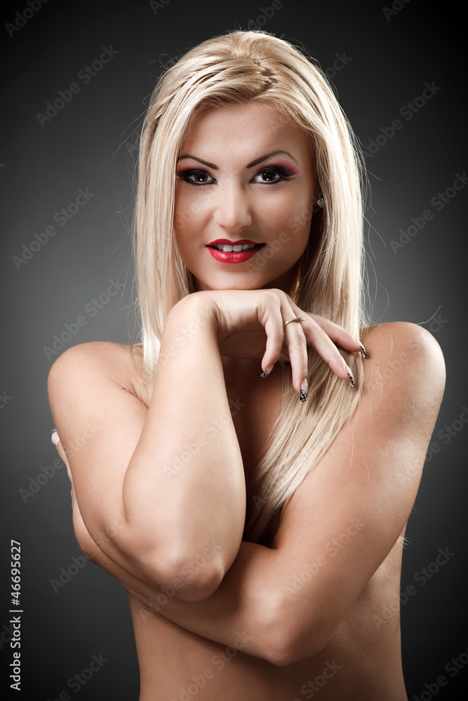 Fototapeta premium Beautiful topless woman holding hand under her chin