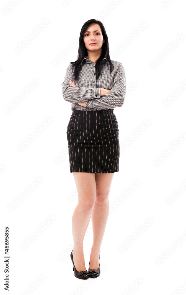 Beautiful businesswoman standing with crossed arms isolated on w Beautiful businesswoman standing with crossed arms isolated on w