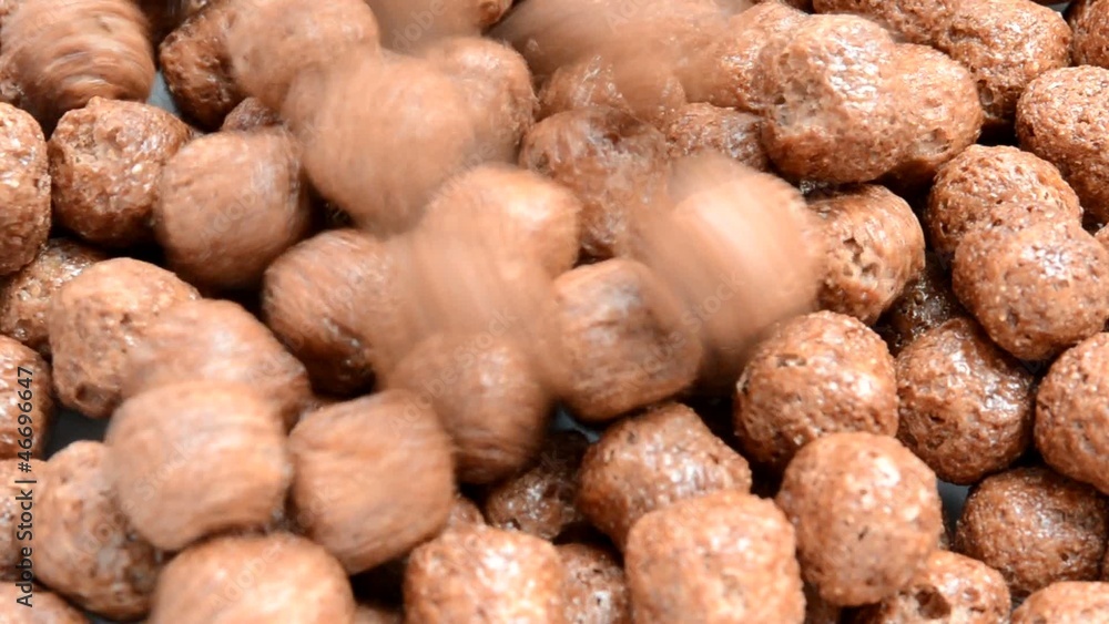 Pile of choco balls cereal pouring into isolated background Pile of choco balls cereal pouring into isolated background