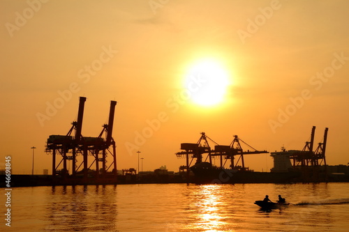 Container cargo freight ship silhouette in the morning