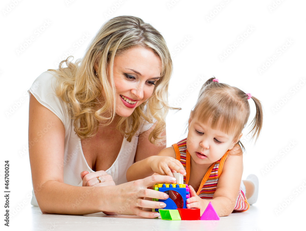 child girl and mother playing together with puzzle toy child girl and mother playing together with puzzle toy