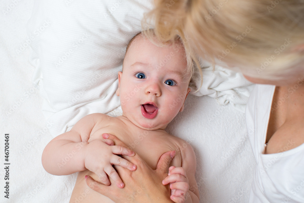 happy mother looking at baby boy
