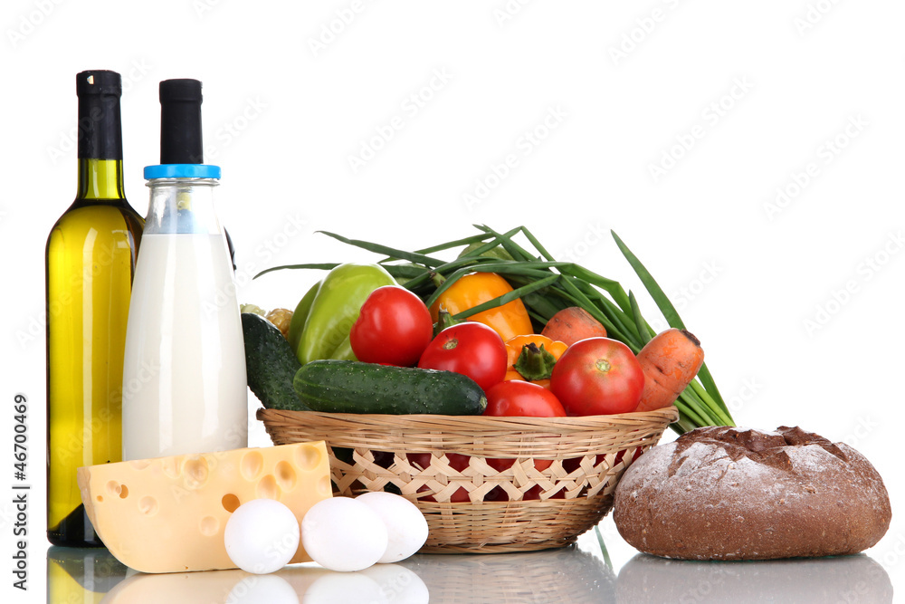 Composition with vegetables in wicker basket isolated on white Composition with vegetables in wicker basket isolated on white