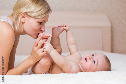 loving mother kissing her baby