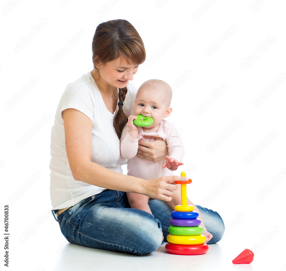 baby girl and mother playing together